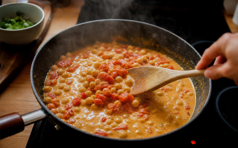 Chickpeas, tomatoes and coconut milk coming together